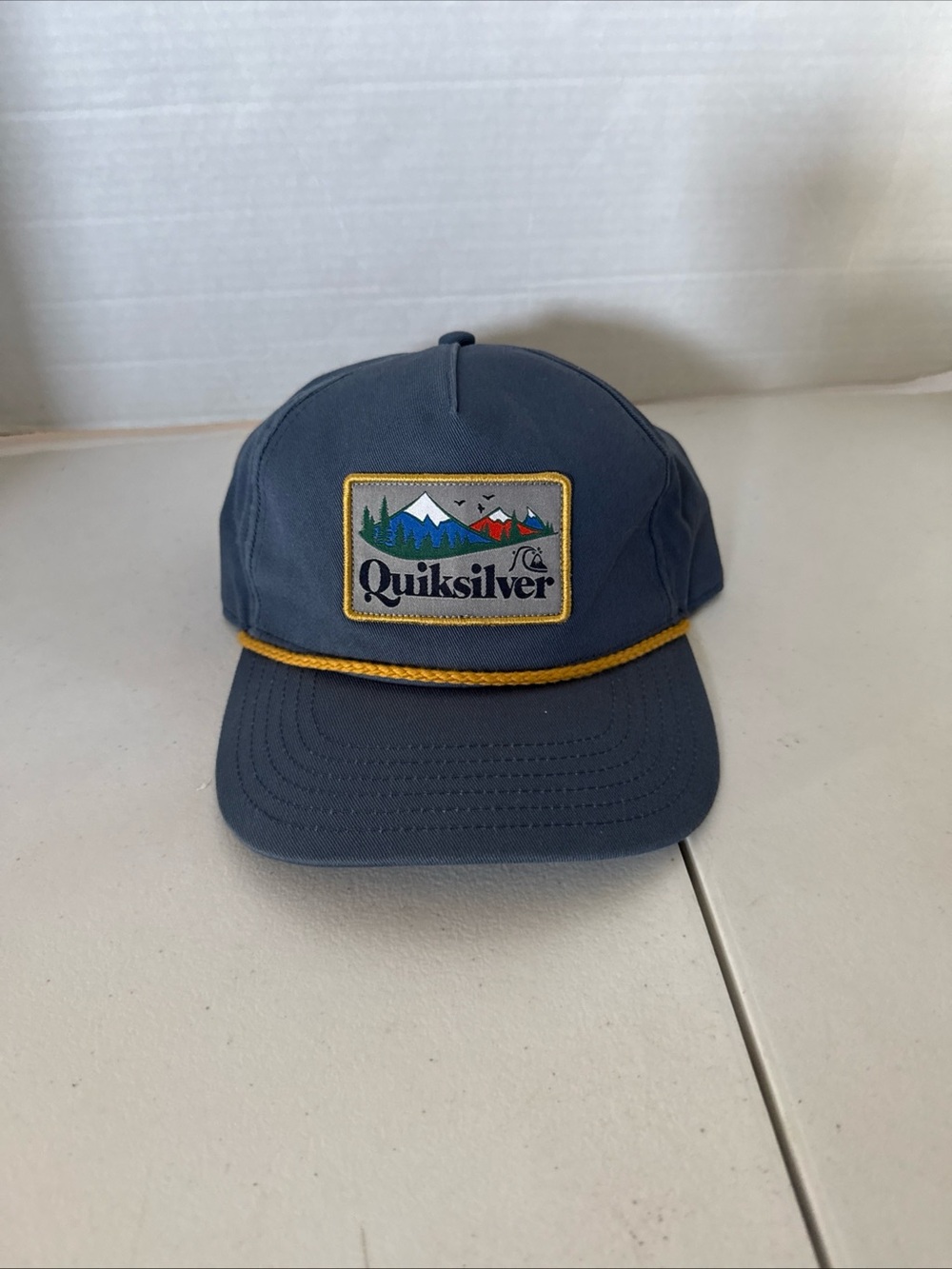 Quiksilver Slate Blue Hat with Yellow Rope Trim and Mountain Patch